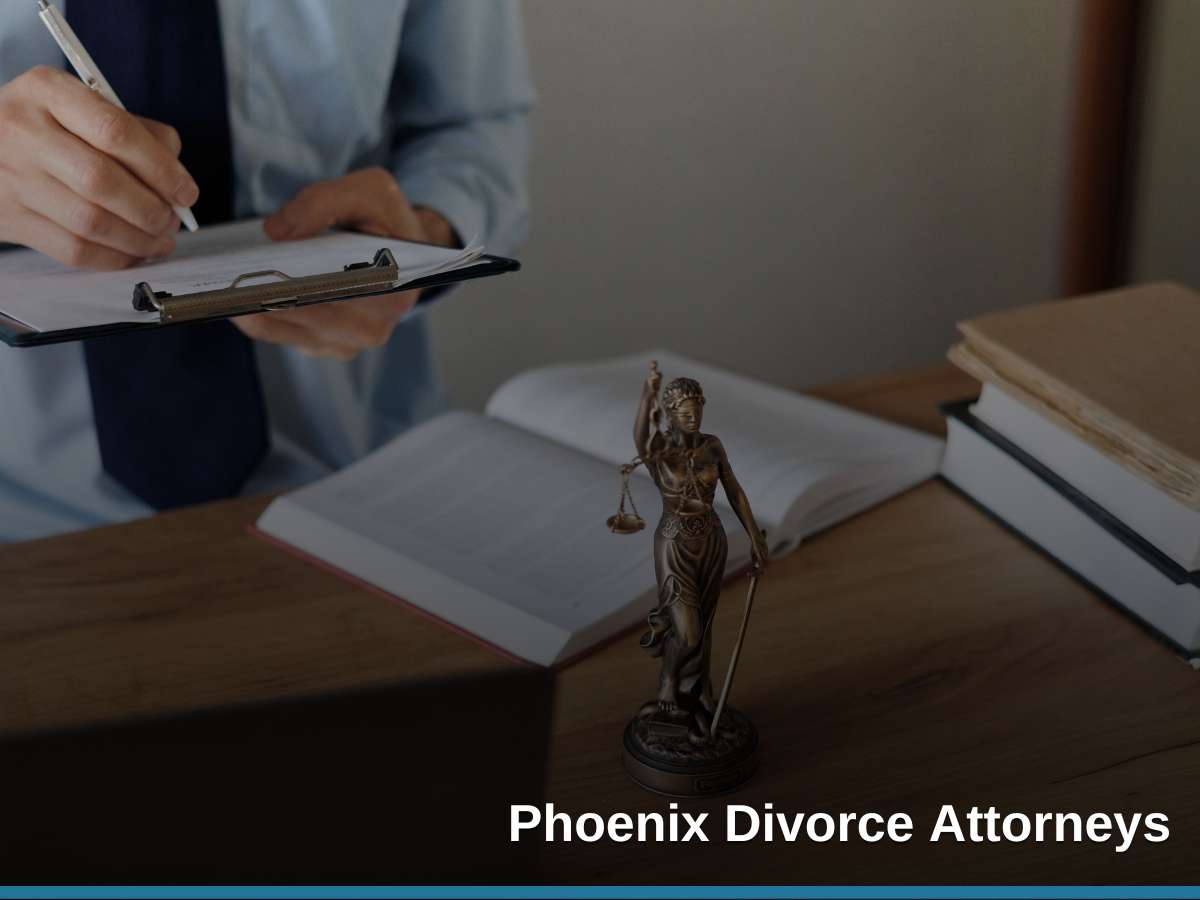 A lawyer reviews documents with a statue of Lady Justice in the foreground, representing the services of Phoenix Divorce Attorneys.